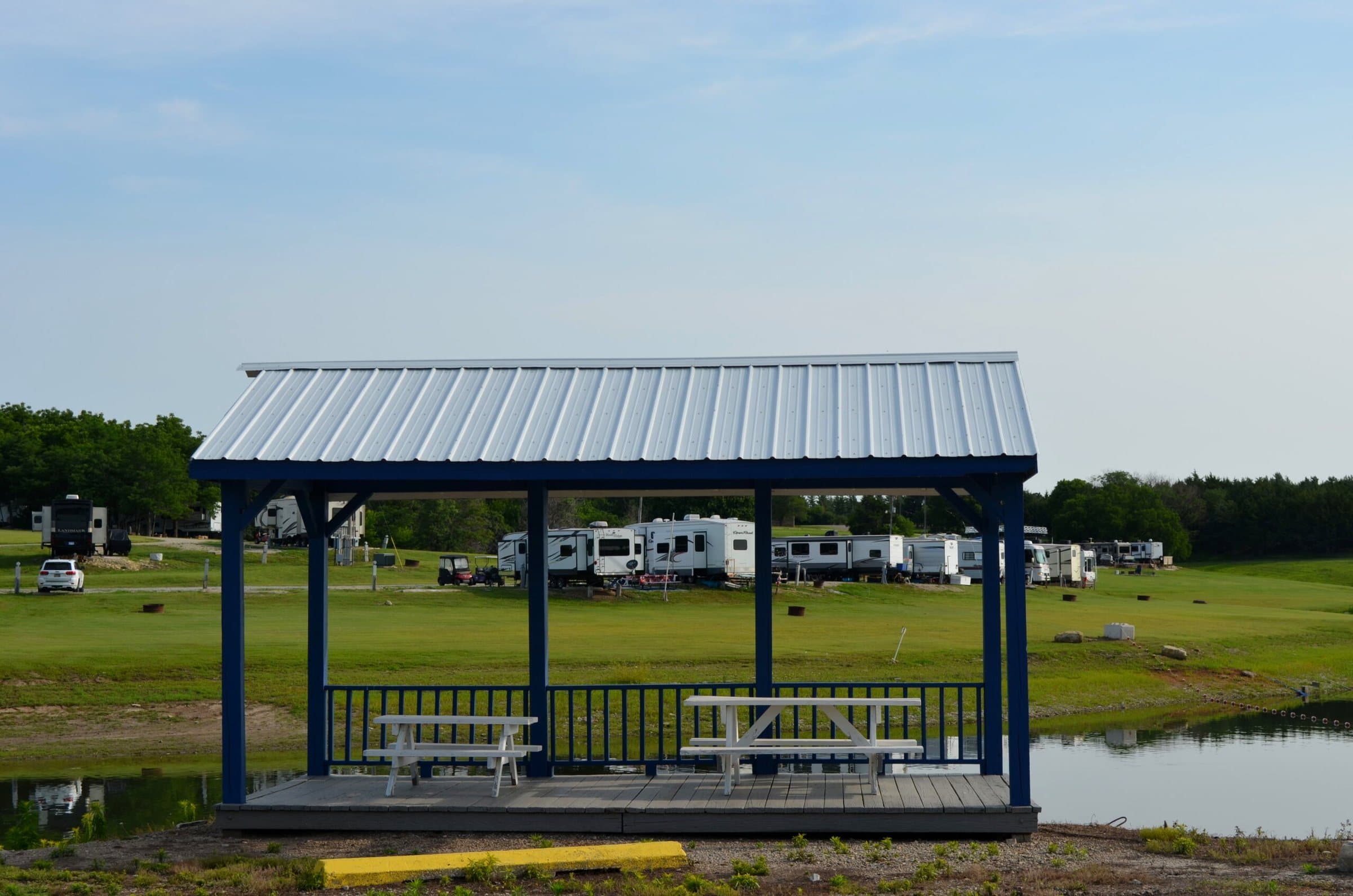 Navy waterfront gazebo with picnic tables